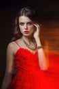 Blurred color art portrait of a girl on a dark background. Fashion woman with beautiful makeup and a light summer dress. Sensual Royalty Free Stock Photo