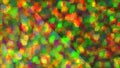 Blurred colorful background of festive confetti and tinsel. Soft focus abstract background. Yellow, green, red color circles Royalty Free Stock Photo