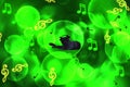 Blurred creative green background with a picture of a black cat listening to music, abstract musical notes Royalty Free Stock Photo