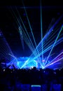 Blurred crowd at concert : Silhouette people crowd happy and cheering in front of colorful stage with bright laser light beam.Ã¢â¬â¹