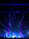 Blurred crowd at concert : Silhouette people crowd happy and cheering in front of colorful stage with bright laser light beam.Ã¢â¬â¹ Royalty Free Stock Photo