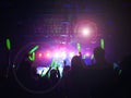 Blurred crowd at concert : Silhouette people crowd happy and cheering in front of colorful stage with bright laser light beam.Ã¢â¬â¹ Royalty Free Stock Photo