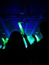 Blurred crowd at concert : Silhouette people crowd happy and cheering in front of colorful stage with bright laser light beam.Ã¢â¬â¹ Royalty Free Stock Photo