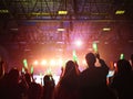 Blurred crowd at concert : Silhouette people crowd happy and cheering in front of colorful stage with bright laser light beam.Ã¢â¬â¹ Royalty Free Stock Photo