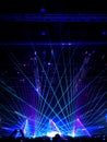 Blurred crowd at concert : Silhouette people crowd happy and cheering in front of colorful stage with bright laser light beam.Ã¢â¬â¹ Royalty Free Stock Photo