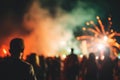 Blurred crowd and fireworks at night concert, music festival Royalty Free Stock Photo