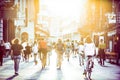 Blurred crowd of people on Copova pedestrian street in Ljubljana at sunset. Urban lifestyle and mobility concept.