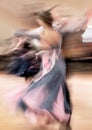 Blurred dancing couple in ballroom Royalty Free Stock Photo