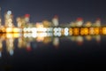 Blurred dark cityscape with illuminated buildings