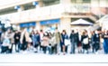 Blurred defocused abstract background of people walking on street - Crowded city center at rush hour in urban area