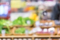 Blurred defocused background of products and counter with herbs in the supermarket
