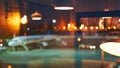 Blurred or defocused beautiful airport terminal early morning or night background with airplane, bokeh lights and glass