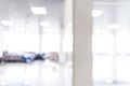 Blurred defocused bokeh background of exhibition hall or convention centre hallway. Business trade show modern white interior arch Royalty Free Stock Photo