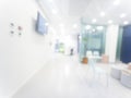 Blurred defocused bokeh background of exhibition hall or convention centre hallway. Business trade show modern white interior Royalty Free Stock Photo