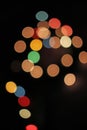 Blurred defocused christmas light lights bokeh background. Colorful red yellow blue green de focused glittering pattern Royalty Free Stock Photo