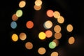 Blurred defocused christmas light lights bokeh background. Colorful red yellow blue green de focused glittering pattern Royalty Free Stock Photo