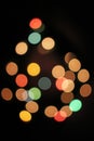 Blurred defocused christmas light lights bokeh background. Colorful red yellow blue green de focused glittering pattern Royalty Free Stock Photo