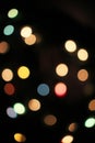 Blurred defocused christmas light lights bokeh background. Colorful red yellow blue green de focused glittering pattern Royalty Free Stock Photo