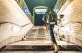 Blurred defocused man with bike going out from Rosa Luxemburg subway station in Berlin