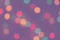 Blurred defocused multicolored bright light, shiny spots, colorful lilac background Royalty Free Stock Photo