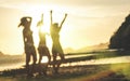 Blurred defocused silhouette of women travelers at sunset - Travel wanderlust concept with young girlfriends partying and dancing Royalty Free Stock Photo