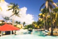 Blurred defocused vacation background with swimming pool bar in luxury tropical hotel resort Royalty Free Stock Photo