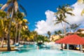 Blurred defocused vacation background with swimming pool bar in luxury tropical hotel resort Royalty Free Stock Photo