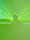 Blurred DJ in the green laser rays Royalty Free Stock Photo