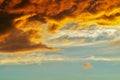 Blurred dramatic sunset like fire in the sky with golden and red clouds. Beautiful abstract colorful background. Defocus Royalty Free Stock Photo
