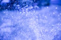 Blurred drops from a water fountain, defocus light, blur bokeh. background as a design element. Abstract blue card Royalty Free Stock Photo