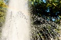 Selective focus on spray of urban fountain and blurred background Royalty Free Stock Photo