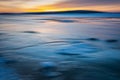 Blurred effect of the sea and sunset. Intentional camera movement creating a dreamy background.