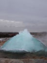 Blurred. The eruption of the Strokkur geyser in the southwestern part of Iceland in a geothermal area near the river Hvitau