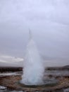 Blurred. The eruption of the Strokkur geyser in the southwestern part of Iceland in a geothermal area near the river Hvitau