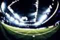 Blurred field with lights and full of spectators at the stadium Royalty Free Stock Photo