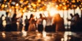 Blurred figures of people dancing in a hall with glowing bokeh lights capturing the warm festive atmosphere of a joyous Royalty Free Stock Photo