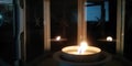 Blurred fire background. Burning candle closeup