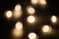 Blurred focus of circular bokeh lights in warm golden tone for abstract background. Seasons greetings, Merry Christmas Royalty Free Stock Photo