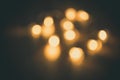 Blurred focus of circular bokeh lights in warm golden tone for abstract background. Seasons greetings, Merry Christmas Royalty Free Stock Photo