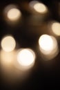 Blurred focus of circular bokeh lights in warm golden tone for abstract background. Seasons greetings, Merry Christmas Royalty Free Stock Photo