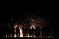 Blurred focus silhouette people looking show of the man spin the fire on beach