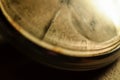 Vintage antique dirty pocket watch with yellowed dial and rusty hands. Clock grunge. Royalty Free Stock Photo