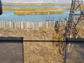 Blurred foreground. View from the train window of the river bottling with colorful banks. Autumn season. Russian open spaces Royalty Free Stock Photo