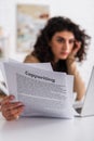 Blurred freelancer holding papers with copywriting