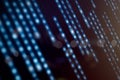 Blurred glowing binary code streams in a digital motion effect, representing fast data transfer, artificial intelligence, Royalty Free Stock Photo
