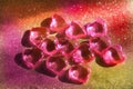 Blurred golden hearts and flare lights. Full frame colorful Valentines Day background of crystal hearts. Luxury greeting card