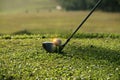 Blurred golf club and golf ball close up in grass field Royalty Free Stock Photo