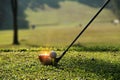 Blurred golf club and golf ball close up in grass field Royalty Free Stock Photo