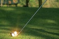 Blurred golf club and golf ball close up in grass field Royalty Free Stock Photo