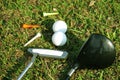 Blurred golf club and golf ball close up in grass field with sunset. Golf ball close up in golf coures Royalty Free Stock Photo